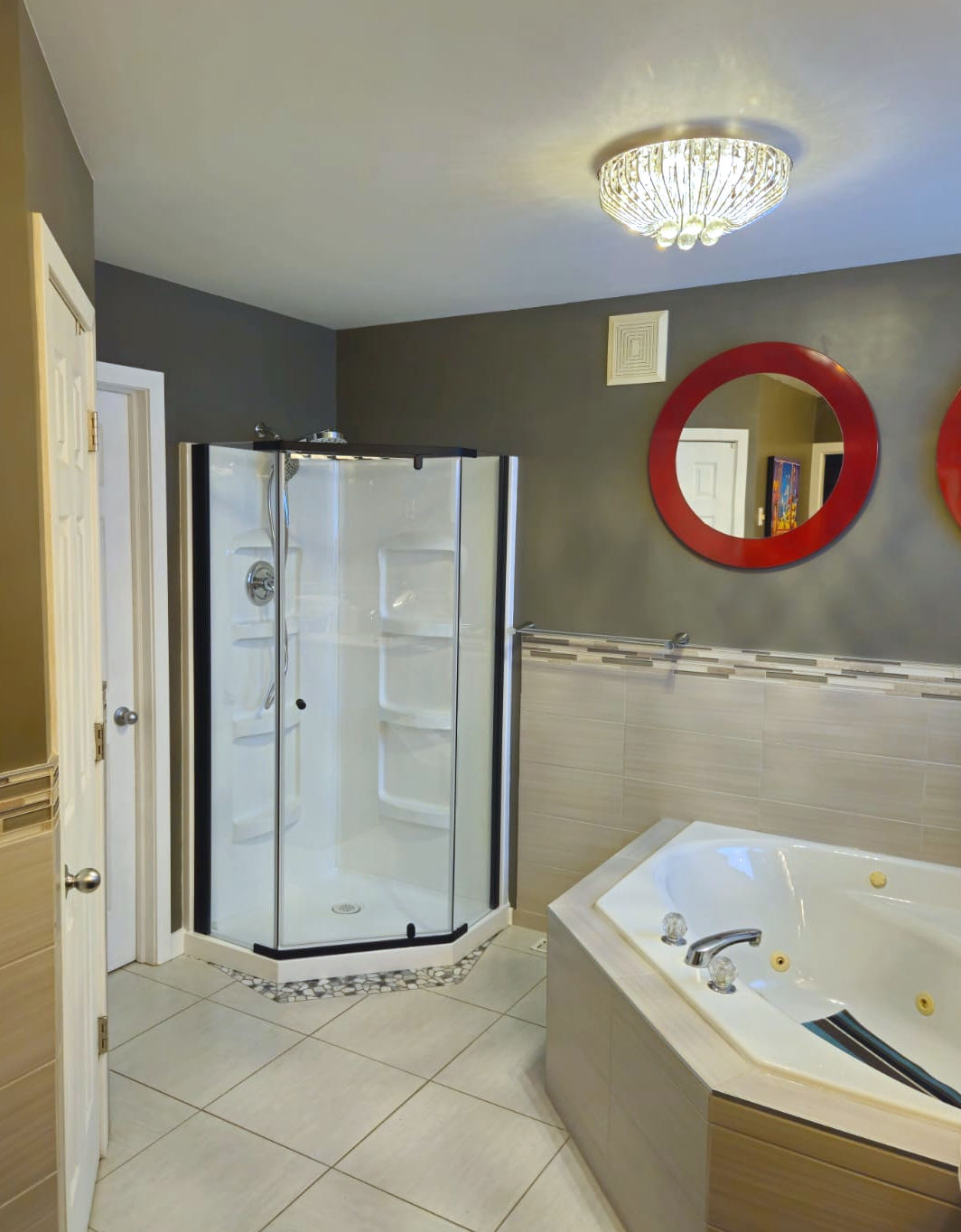 Complete bathroom remodel in St. Andrews featuring a separate corner shower and jetted tub, with custom tile work by JSDC Renovations.