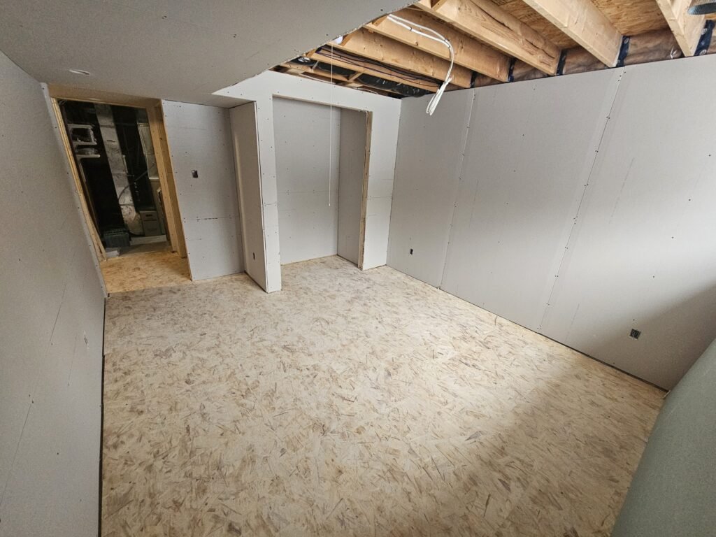 Empty room with drywall and sub-flooring